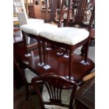 A mahogany reproduction extending dining table with 4 chairs