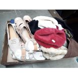 A box of misc hats and shoes