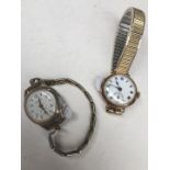 A ladies 9ct gold cased wristwatch and another