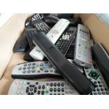 A box of assorted remote controls