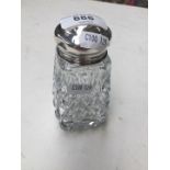 A cut glass sugar sifter with silver top (Birmingham Hallmark)