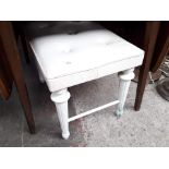 A white dressing table stool