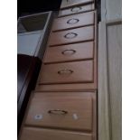 A pair of 4 drawer small units and a bedside cabinet