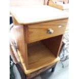 A pine bedside cabinet