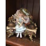 A late 19th century German bisque porcelain figural inkwell.