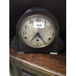 An oak mantle clock