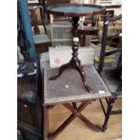 A tripod table and an x frame table
