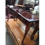 A reproduction mahogany 3 drawer hall table