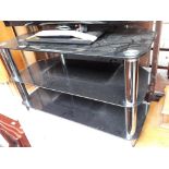 A black glass tv stand