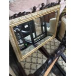 A gilt framed mirror