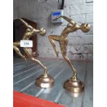 A pair of brass female figurines