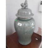 A green crackle glazed vase and cover