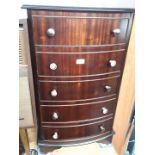 A reproduction bow front chest of drawers