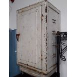 A vintage metal meat cupboard