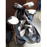 A set of Lynx irons and Ping woods golf clubs and bag