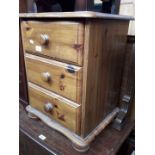 A pine 3 drawer bedside table