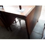 A teak drop leaf table