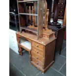A pine knee hole dressing table with mirror and stool