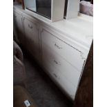 A cream bedroom sideboard