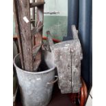Old wooden stool, ladders and a large galvanised metal tub