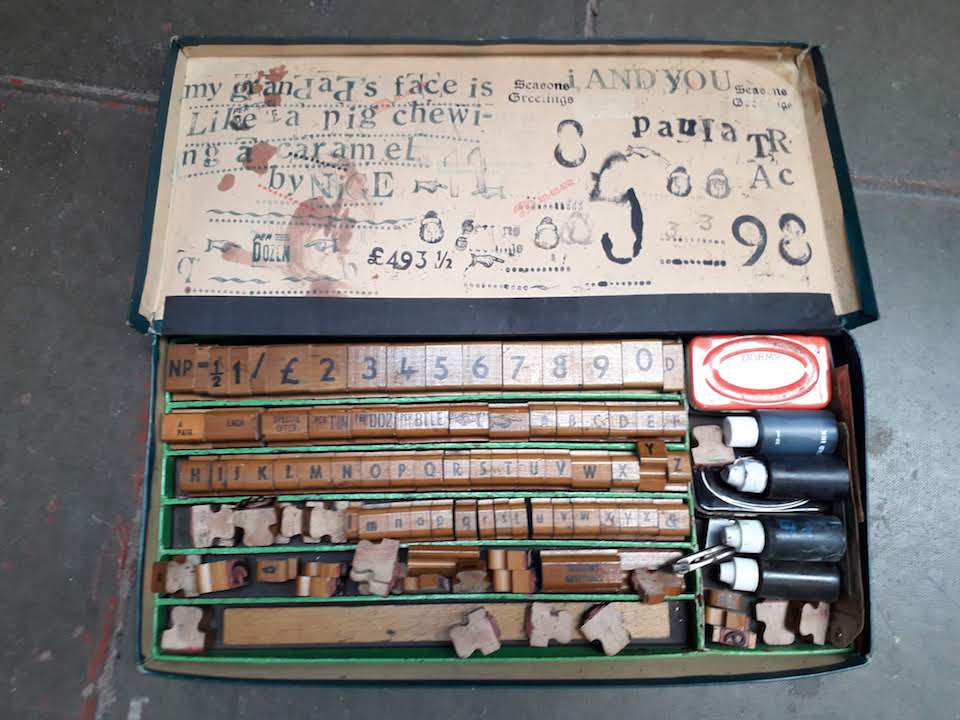 A box of wooden printing blocks, dyes and accessories