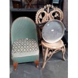 A folding table, cane chair and green woven chair