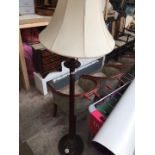 An Edwardian fluted mahogany standard lamp.