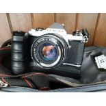 A camera bag with Pentax ME camera and 2 lenses