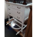 A white painted dressing table with mirror