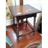 An oak small occasional table with turned legs and beadwork