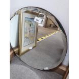 A round bevelled edge mirror