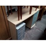 A modern 4 drawer pedestal desk
