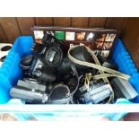 A box of photography equipment, including Miranda, Canon, Zenit, etc