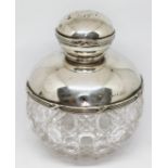 A hallmarked silver topped cut glass scent bottle, height 10.5cm.