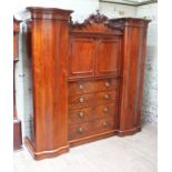 A good quality William IV/Early Victorian reverse breakfront mahogany wardrobe comprising central