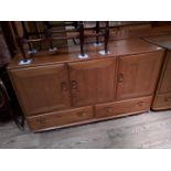 An Ercol blonde elm sideboard.