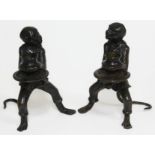 A pair of bronze candlesticks each formed as a fully clothed monkey and holding a platter, height