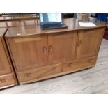 An Ercol blonde elm sideboard.