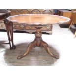 A George III and later mahogany bird cage tripod table with Acanthus carved legs and shell carved