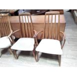 A pair of Koefoeds Danish teak armchairs.
