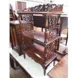 A Victorian mahogany whatnot with pierced sides and turned supports, height 100cm.