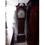 A Georgian mahogany long case clock circa 1800 with broken swan neck pediment, arched hood with