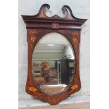 An Edwardian inlaid mahogany mirror of shield form with broken swan neck pediment, Classical inlay