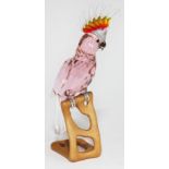 A Swarovski Paradise Birds cockatoo on naturalistically formed wooden base, height 24cm. Condition -