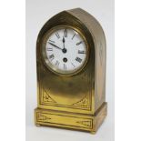 A late 19th century arched brass mantle clock, the movement stamped 'Maple & Co Paris', height 27cm.