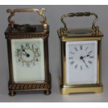 A late 19th century brass carriage clock height 15cm and another.