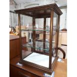 A Cadbury's shop display cabinet, the front glass etched 'Cadbury's Chocolate' width 43cm, depth