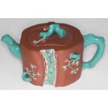 A Chinese Yixing red clay teapot, seal mark to base, length 19cm. Condition - chip to inside of lid,