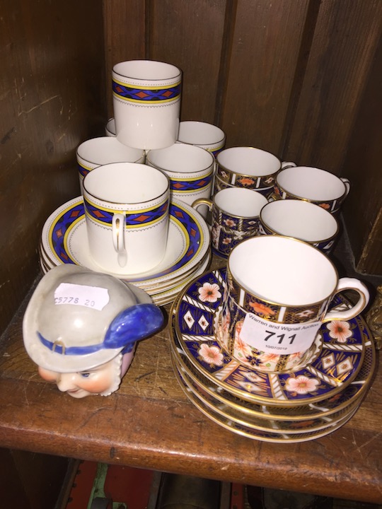 Royal Crown Derby and Shelley coffee cans and saucers and a continental porcelain jar formed as a