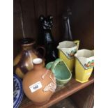 A shelf of misc pottery including cat, birds, etc